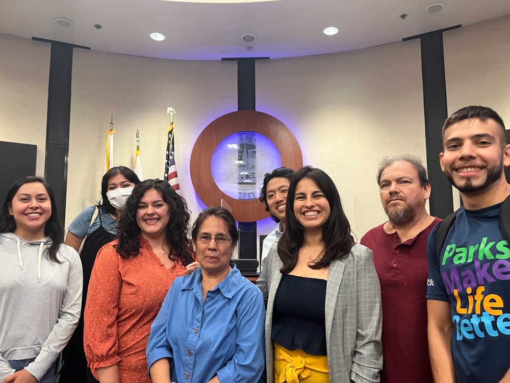 Mayor Pro Tem Jorgel Chavez (far right) joins local activists for a photo at City Hall while they delivered the climate emergency kit
